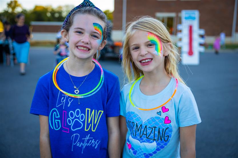 Two girls smile